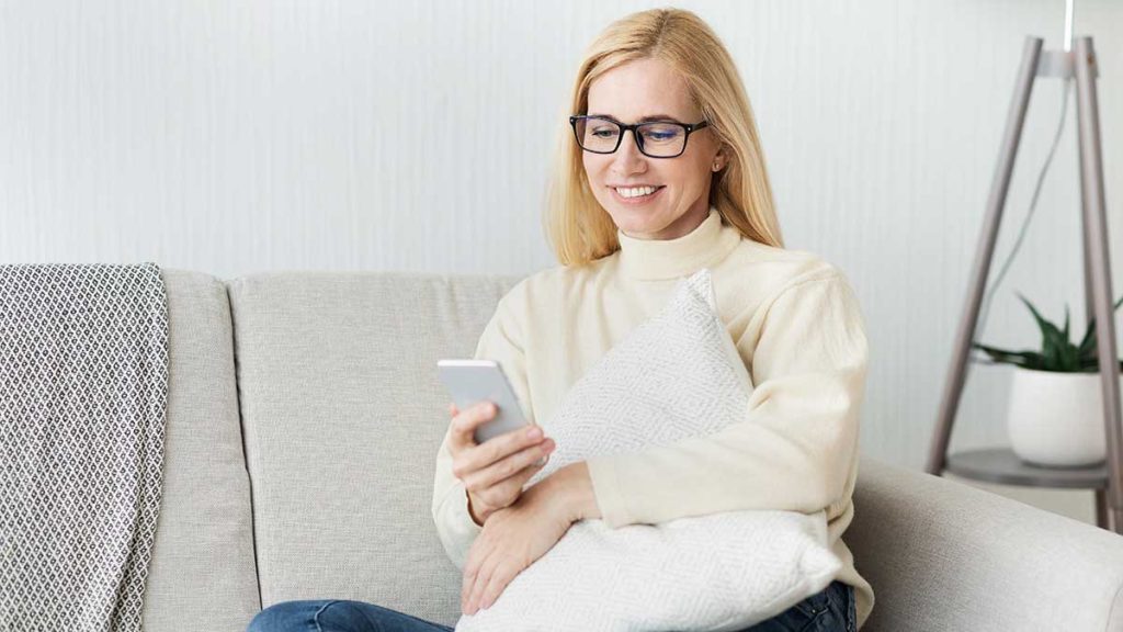 new-user-excited-woman-using-her-smartphone-3481576