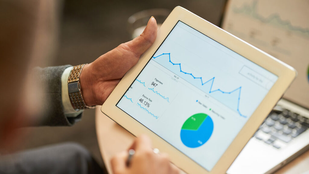 Person holding a tablet tracking website analytics in ocala